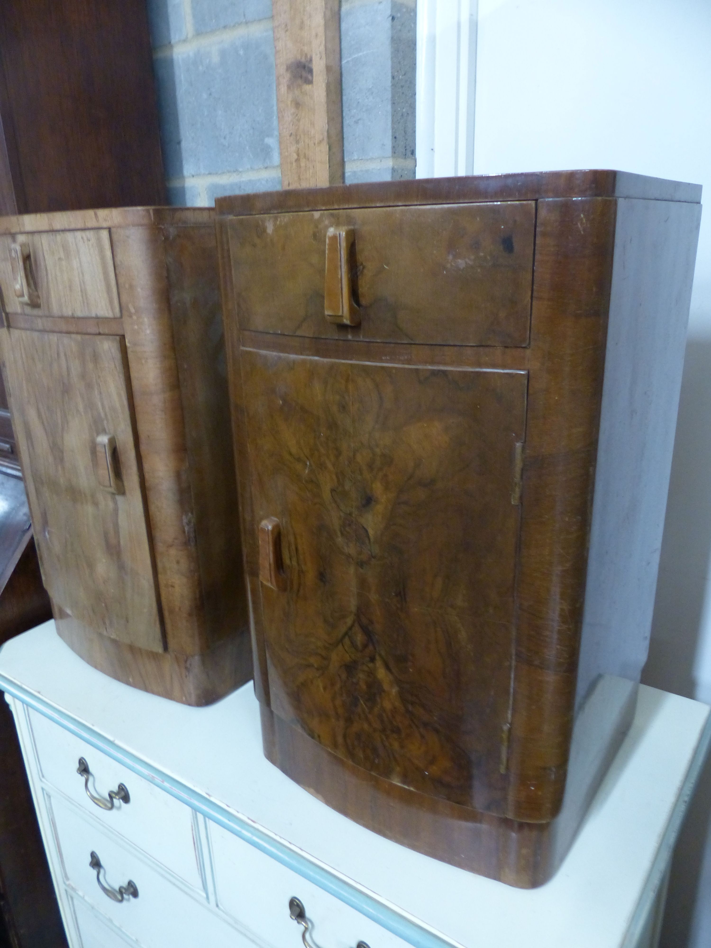 A pair of Art Deco walnut bedside cabinets, W.38cm D.38cm H.67cm